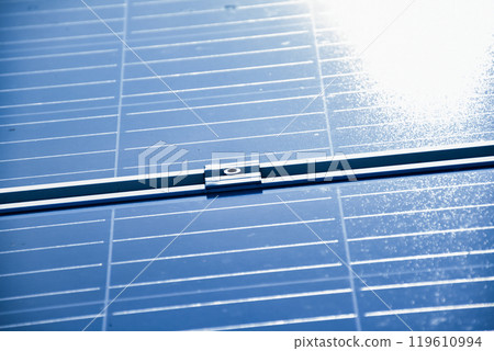 closeup photovoltaic panels which installed on the rooftop of the building, concept for storing and using natural power from the sunlight to care about human environment over the world. closeup photovoltaic panels which installed on the rooftop of the building, concept for storing and using natural power from the sunlight to care about human environment over the world. 119610994