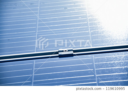 closeup photovoltaic panels which installed on the rooftop of the building, concept for storing and using natural power from the sunlight to care about human environment over the world. closeup photovoltaic panels which installed on the rooftop of the building, concept for storing and using natural power from the sunlight to care about human environment over the world. 119610995