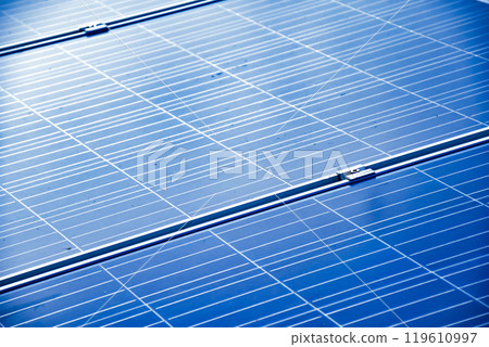 closeup photovoltaic panels which installed on the rooftop of the building, concept for storing and using natural power from the sunlight to care about human environment over the world. 119610997
