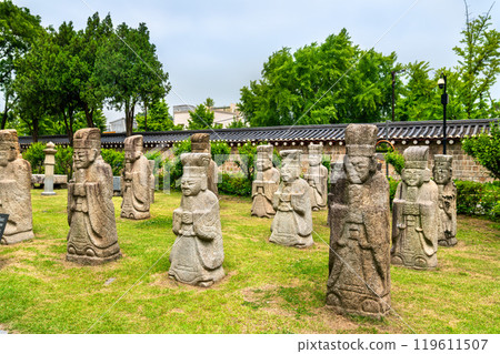Traditional Muninseok Stone Statues at the National Folk Museum in Seoul, South Korea 119611507