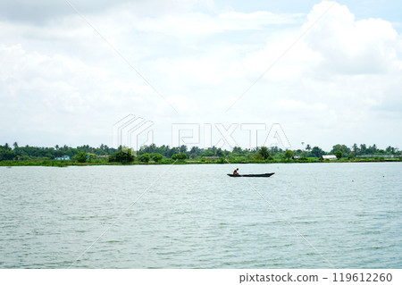 Fisher man and Boat at Kharibari Kolkata Fisher man and Boat at Kharibari Kolkata 119612260