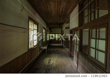 Remains of a corridor in an abandoned elementary school building Remains of a corridor in an abandoned elementary school building 119612983