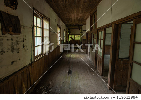 Remains of a corridor in an abandoned elementary school building Remains of a corridor in an abandoned elementary school building 119612984