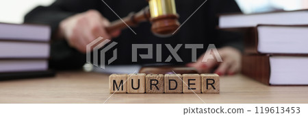 World Murder on wooden blocks and judge knocking gavel 119613453