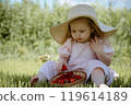 Delightful Moments: Child Enjoying Strawberries on 119614189
