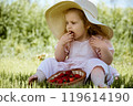 Delightful Moments: Child Enjoying Strawberries on 119614190