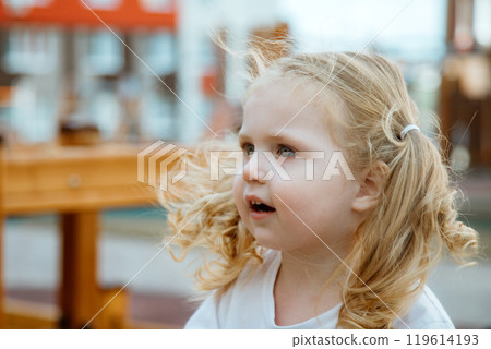 A Playful Child Happily Enjoying Various Outdoor A Playful Child Happily Enjoying Various Outdoor 119614193