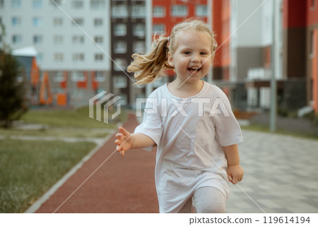 A Playful Child Happily Enjoying Various Outdoor A Playful Child Happily Enjoying Various Outdoor 119614194