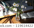 A close-up of autumn chrysanthemums arranged on the living room table 119614422
