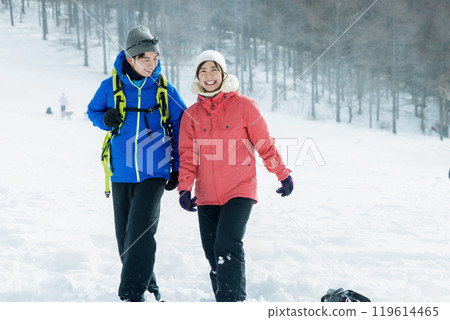 Couple enjoying the snowy mountains Couple enjoying the snowy mountains 119614465