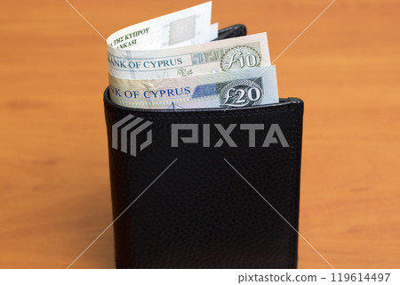 Cypriot pound in the black wallet Cypriot pound in the black wallet 119614497