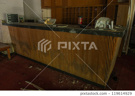 Remains of the abandoned hotel front desk Remains of the abandoned hotel front desk 119614929