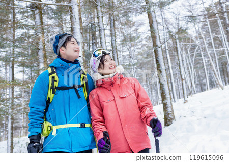 Couple enjoying snowshoes Couple enjoying snowshoes 119615096