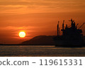 A ship illuminated by the setting sun 119615331