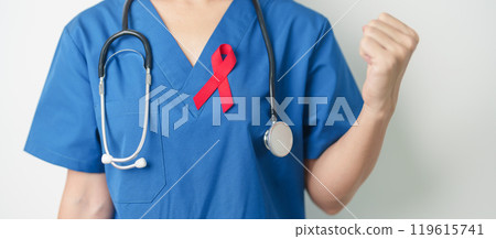 Doctor with Red Ribbon for December World Aids Day, acquired immune deficiency syndrome, multiple myeloma Cancer Awareness month and National Red ribbon week. Healthcare and world cancer day concept 119615741