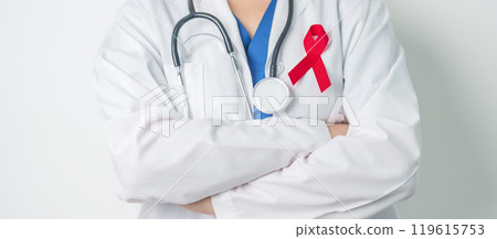 Doctor with Red Ribbon for December World Aids Day, acquired immune deficiency syndrome, multiple myeloma Cancer Awareness month and National Red ribbon week. Healthcare and world cancer day concept 119615753