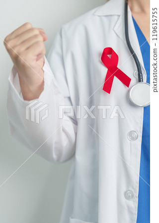 Doctor with Red Ribbon for December World Aids Day, acquired immune deficiency syndrome, multiple myeloma Cancer Awareness month and National Red ribbon week. Healthcare and world cancer day concept 119615755