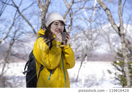 Woman enjoying winter leisure Woman enjoying winter leisure 119616428
