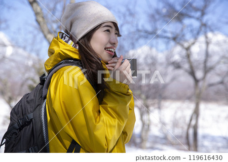 Woman enjoying winter leisure Woman enjoying winter leisure 119616430