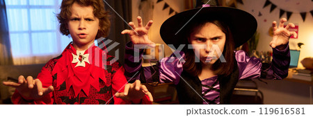 Scowling Halloween witch and demon Scowling Halloween witch and demon 119616581