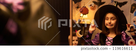 Little witch getting ready for party Little witch getting ready for party 119616611