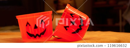 Two orange buckets for Halloween treats 119616632
