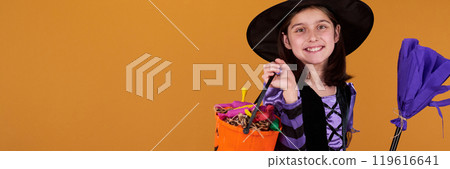 Happy witch with broom and treats Happy witch with broom and treats 119616641