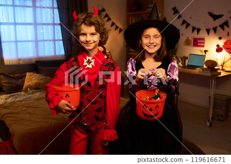 Cheerful cute kids in Halloween outfit 119616671