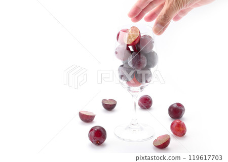 Grapes (Pione) in a wine glass on a white background 119617703