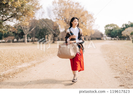 A woman going out in winter 119617823