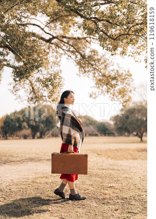 A woman going out in winter 119618159