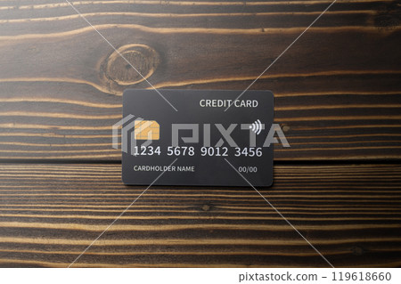 Top view of debit or credit card on wooden background 119618660