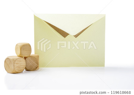 Envelope and postcard with stack of wooden cubes on white background 119618668