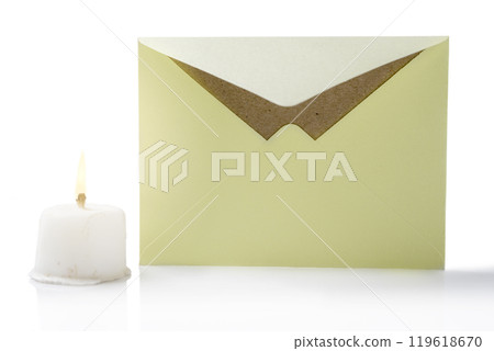 Envelope and postcard with candle on white background Envelope and postcard with candle on white background 119618670