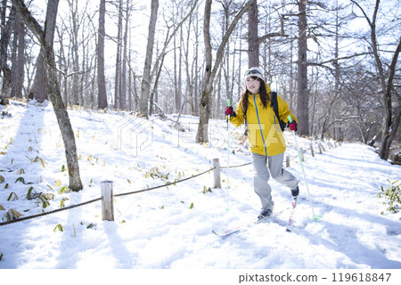 Woman enjoying winter leisure Woman enjoying winter leisure 119618847