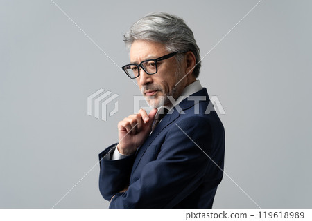 Businessman, gray hair, thinking, profile 119618989