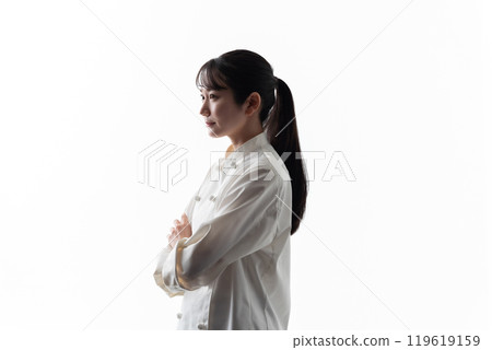 Woman in chef's coat silhouette thinking 119619159