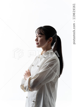 Woman in chef's coat silhouette thinking Woman in chef's coat silhouette thinking 119619161