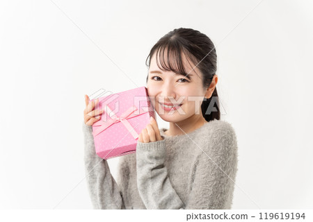 A woman with a present A woman with a present 119619194