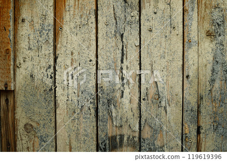 Weathered wooden planks with layers of texture and rustic charm in natural light 119619396