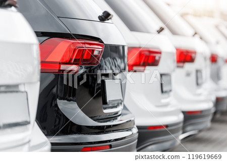 Back view many modern new SUV cars fleet stock at dealership parking lot. Automobile market production factory industry warehouse. Auto salvage buy and sell auction purchase seller platform Back view many modern new SUV cars fleet stock at dealership parking lot. Automobile market production factory industry warehouse. Auto salvage buy and sell auction purchase seller platform 119619669