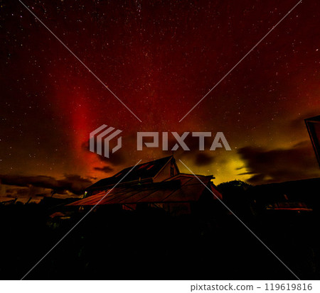 The Aurora Borealis, the northern lights, showing up above bungalow in County Donegal, Ireland 119619816