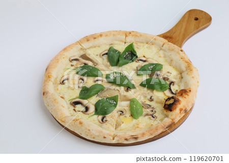 Appetizing Italian pizza with a variety of cheeses and mushrooms on a creamy sauce served on a wooden board on a white background 119620701