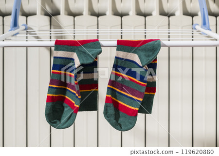 Cotton socks on clothesline. 119620880