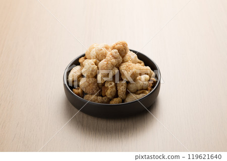 Kaeb Moo or Crispy pork rinds are a popular Thai snack. Kaeb Moo or Crispy pork rinds are a popular Thai snack. 119621640