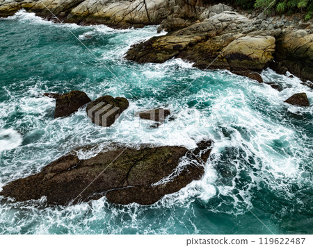 High angle view Beautiful Seashore with waves crashing on rocks 119622487