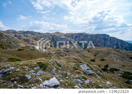 Rocky mountain landscape with winding road and blue sky. Durmitor National Park Montenegro 119622820