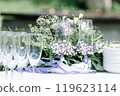 Elegant Wedding Table Setting with Floral Decor 119623114