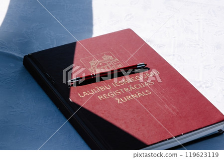 Wedding Registration Book with Pen on Table Wedding Registration Book with Pen on Table 119623119