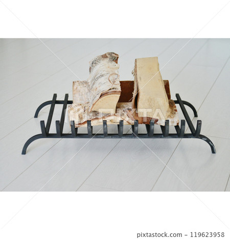 An object photo shoot of black grilles for fireplaces on a light background in the interior. 119623958